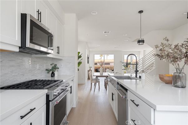 Dining room, Interior, Kitchen, Pendant Lights, Recessed Lighting, Stainless Steel Appliances, Wood Texture Flooring
