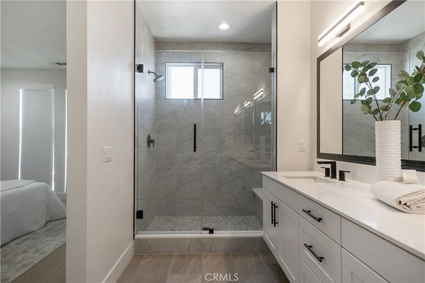 Bathroom, Dual Sink Vanities, Glass Shower, Interior, Marble Walls, Recessed Lighting