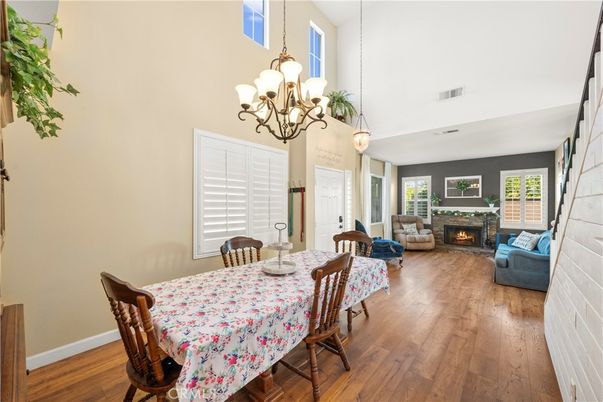Chandelier, Dining room, Fireplace, Interior, Living room, Pendant Lights, Wood Texture Flooring