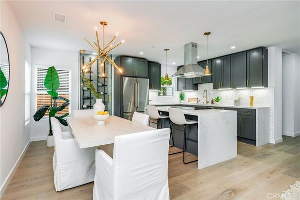 Dining room, Interior, Kitchen, Pendant Lights, Recessed Lighting, Stainless Steel Appliances, Wood Texture Flooring