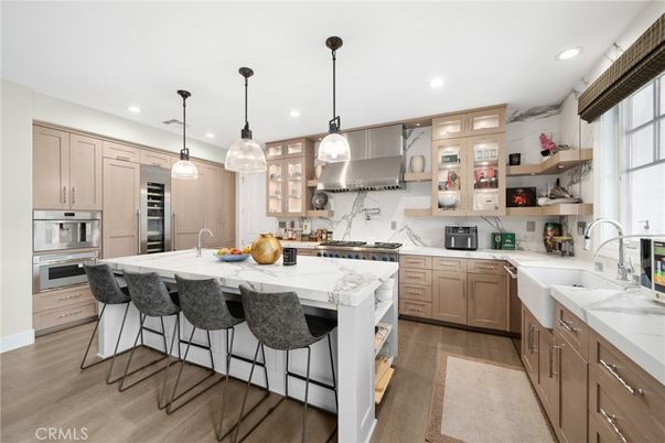 Interior, Kitchen, Marble Walls, Pendant Lights, Recessed Lighting, Stainless Steel Appliances, Wood Texture Flooring