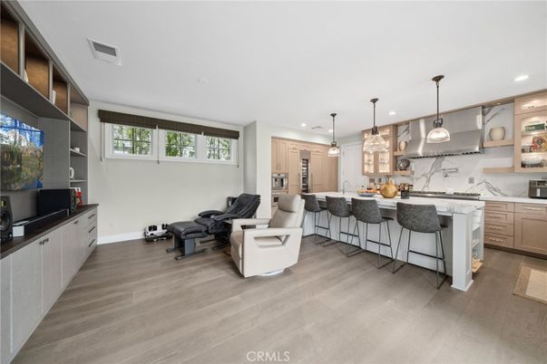 Interior, Kitchen, Living room, Marble Walls, Pendant Lights, Recessed Lighting, Stainless Steel Appliances, Wood Texture Flooring