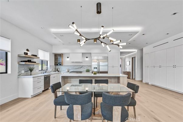 Dining room, Fireplace, Interior, Kitchen, Living room, Marble Walls, Pendant Lights, Recessed Lighting, Wood Texture Flooring