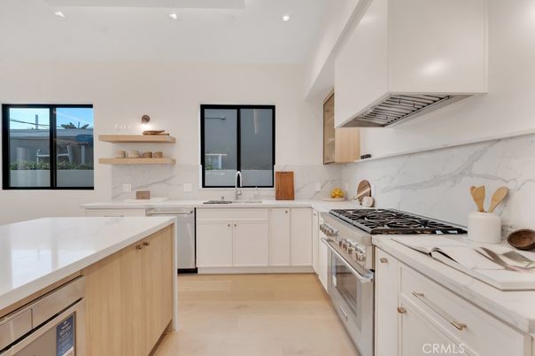 Interior, Kitchen, Marble Walls, Recessed Lighting, Stainless Steel Appliances
