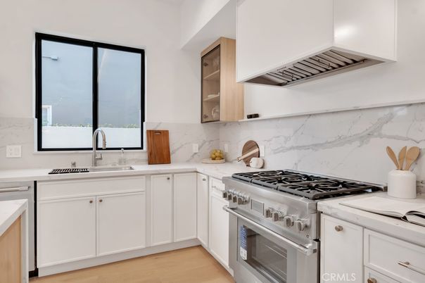 Interior, Kitchen, Marble Walls, Stainless Steel Appliances, Wood Texture Flooring