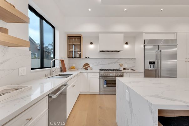 Interior, Kitchen, Marble Walls, Recessed Lighting, Stainless Steel Appliances, Wood Texture Flooring