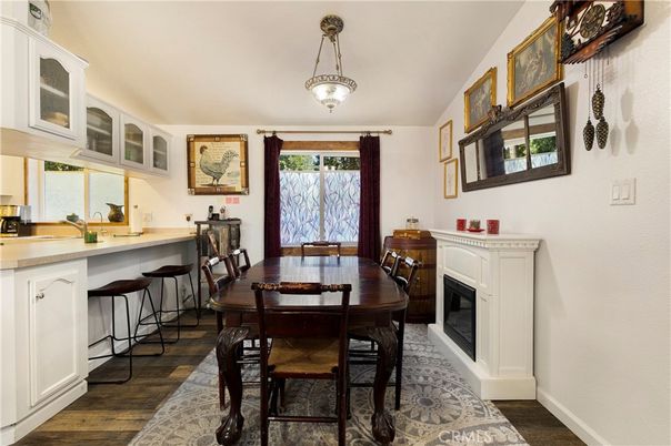 Dining room, Fireplace, Interior, Pendant Lights, Wood Texture Flooring
