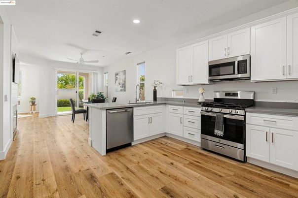 Dining room, Interior, Kitchen, Recessed Lighting, Stainless Steel Appliances, Wood Texture Flooring