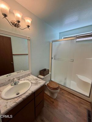 Bathroom, Dual Sink Vanities, Glass Shower, Interior, Wood Texture Flooring