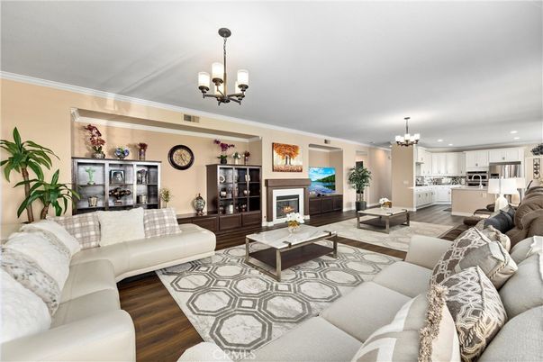 Chandelier, Fireplace, Interior, Kitchen, Living room, Recessed Lighting, Wood Texture Flooring