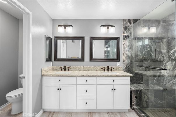 Bathroom, Dual Sink Vanities, Glass Shower, Interior, Marble Walls