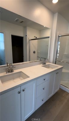 Bathroom, Dual Sink Vanities, Interior, Recessed Lighting, Wood Texture Flooring