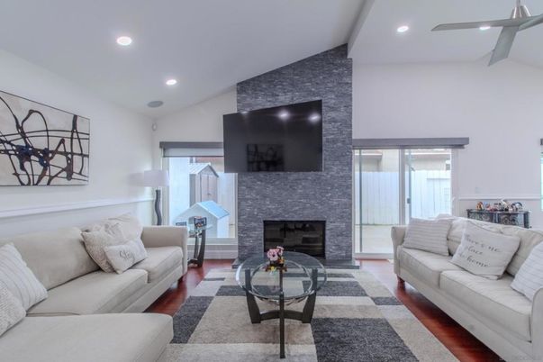 Fireplace, Interior, Living room, Recessed Lighting, Stone Walls, Wood Texture Flooring