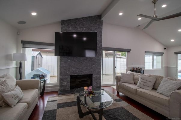 Fireplace, Interior, Living room, Recessed Lighting, Stone Walls, Wood Texture Flooring