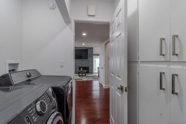 Fireplace, Interior, Recessed Lighting, Stone Walls, Washer, Wood Texture Flooring
