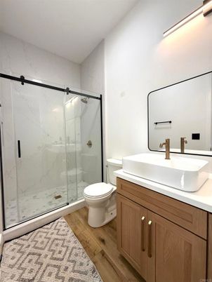 Bathroom, Glass Shower, Interior, Marble Walls, Wood Texture Flooring