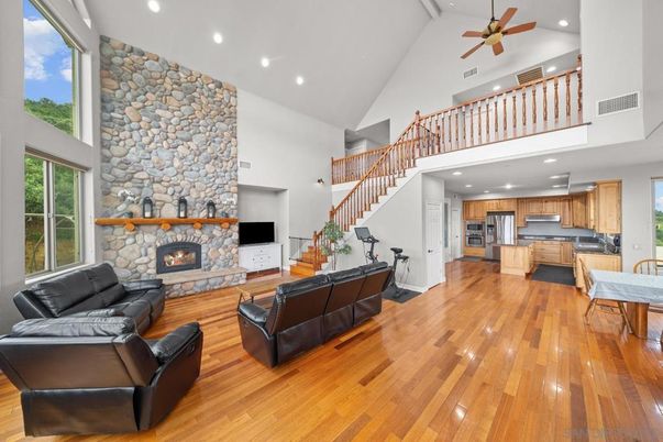 Fireplace, Interior, Kitchen, Living room, Recessed Lighting, Stainless Steel Appliances, Stone Walls, Wood Texture Flooring