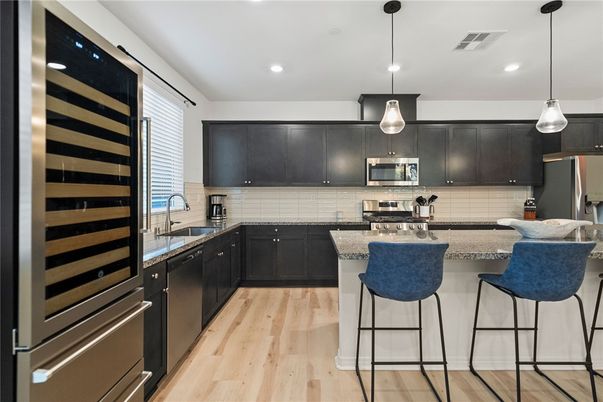 Interior, Kitchen, Pendant Lights, Recessed Lighting, Stainless Steel Appliances, Wood Texture Flooring