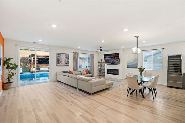 Dining room, Fireplace, Interior, Living room, Pendant Lights, Recessed Lighting, Wood Texture Flooring