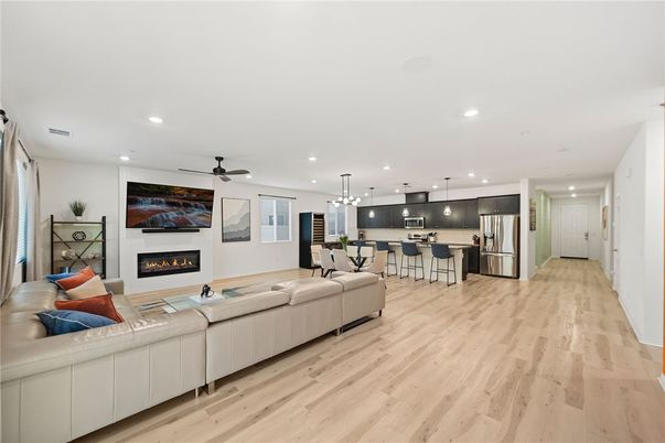 Dining room, Fireplace, Interior, Kitchen, Living room, Pendant Lights, Recessed Lighting, Stainless Steel Appliances, Wood Texture Flooring