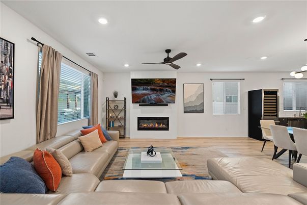 Dining room, Fireplace, Interior, Living room, Recessed Lighting, Wood Texture Flooring