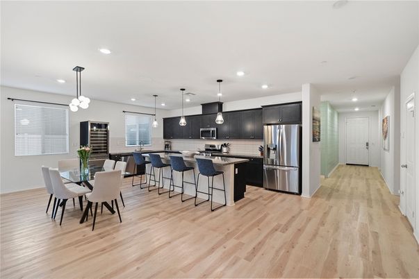 Dining room, Interior, Kitchen, Pendant Lights, Recessed Lighting, Stainless Steel Appliances, Wood Texture Flooring