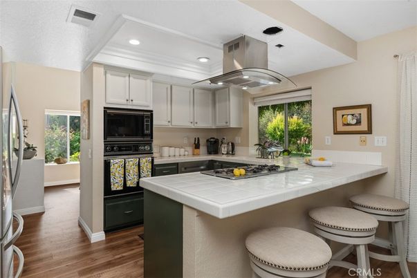 Interior, Kitchen, Recessed Lighting, Tile Countertops, Wood Texture Flooring