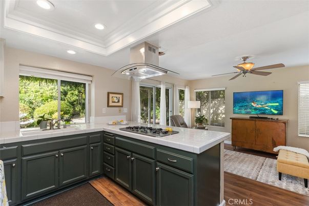 Interior, Kitchen, Recessed Lighting, Tile Countertops, Wood Texture Flooring