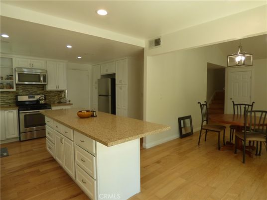 Dining room, Interior, Kitchen, Recessed Lighting, Stainless Steel Appliances, Wood Texture Flooring
