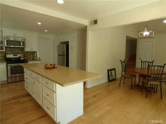 Dining room, Interior, Kitchen, Recessed Lighting, Stainless Steel Appliances, Wood Texture Flooring