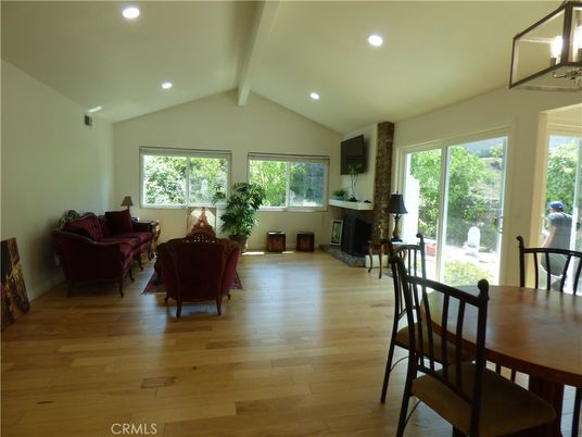 Dining room, Fireplace, Interior, Living room, Recessed Lighting, Wood Texture Flooring