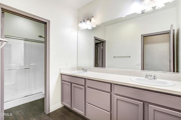 Bathroom, Dual Sink Vanities, Glass Shower, Interior, Wood Texture Flooring