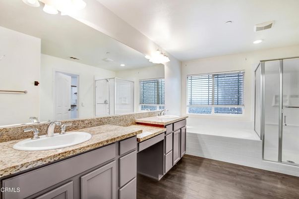 Bathroom, Dual Sink Vanities, Glass Shower, Interior, Recessed Lighting, Wood Texture Flooring