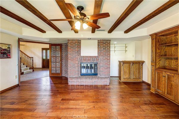 Empty room, Fireplace, Interior, Stone Walls, Wooden Beams, Wood Texture Flooring