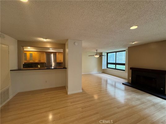 Empty room, Fireplace, Interior, Kitchen, Recessed Lighting, Wood Texture Flooring