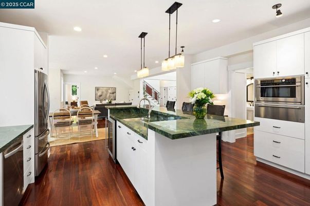 Dining room, Interior, Kitchen, Pendant Lights, Recessed Lighting, Stainless Steel Appliances, Wood Texture Flooring