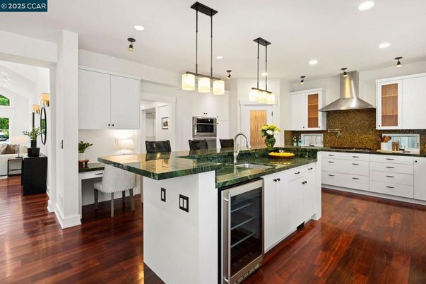 Dining room, Interior, Kitchen, Pendant Lights, Recessed Lighting, Stainless Steel Appliances, Wood Texture Flooring