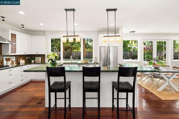 Dining room, Interior, Kitchen, Pendant Lights, Recessed Lighting, Stainless Steel Appliances, Wood Texture Flooring