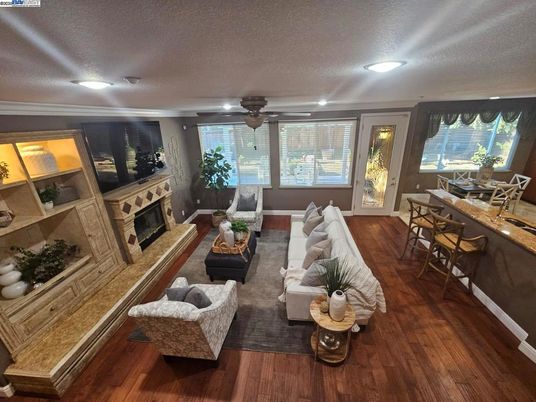 Dining room, Fireplace, Interior, Living room, Recessed Lighting, Wood Texture Flooring