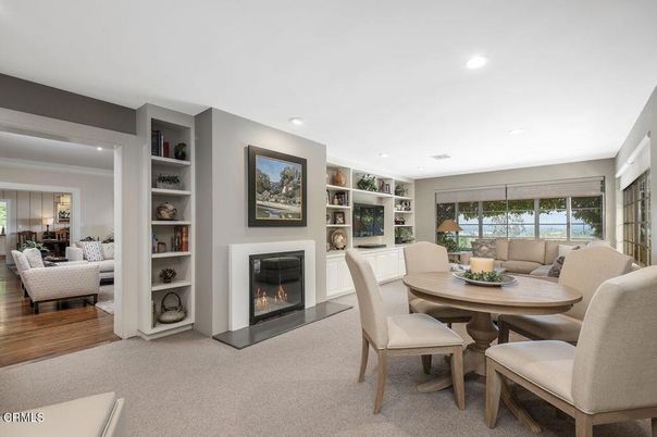 Dining room, Fireplace, Interior, Living room, Recessed Lighting, Wood Texture Flooring