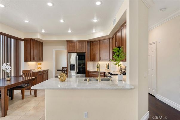 Dining room, Interior, Kitchen, Recessed Lighting, Stainless Steel Appliances, Wood Texture Flooring