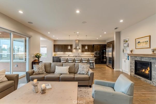Fireplace, Interior, Kitchen, Living room, Pendant Lights, Recessed Lighting, Stainless Steel Appliances, Wood Texture Flooring