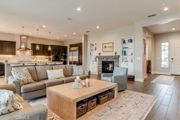 Fireplace, Interior, Kitchen, Living room, Pendant Lights, Recessed Lighting, Stainless Steel Appliances, Wood Texture Flooring