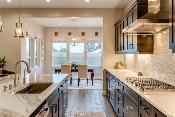 Chandelier, Dining room, Interior, Kitchen, Pendant Lights, Recessed Lighting, Stainless Steel Appliances, Wood Texture Flooring