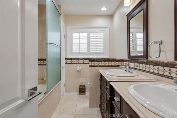 Bathroom, Dual Sink Vanities, Interior, Recessed Lighting, Tile Countertops
