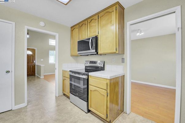 Interior, Kitchen, Tile Countertops, Wood Texture Flooring