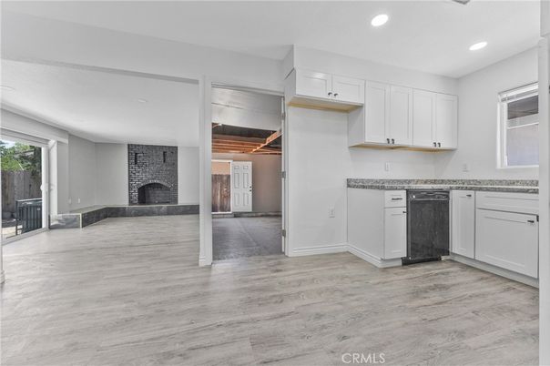 Fireplace, Interior, Kitchen, Recessed Lighting, Stone Walls, Wood Texture Flooring