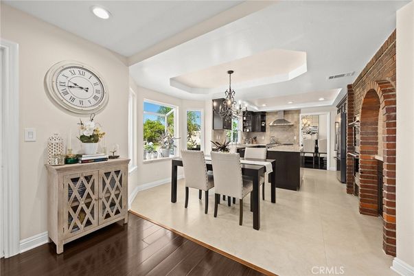 Chandelier, Dining room, Interior, Kitchen, Recessed Lighting, Stainless Steel Appliances, Stone Walls, Wood Texture Flooring