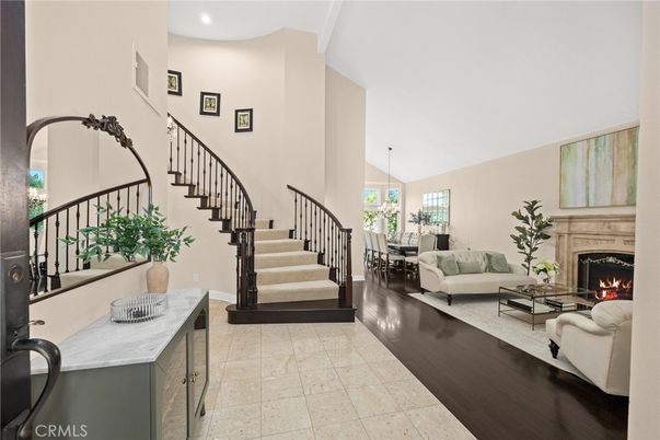 Chandelier, Dining room, Fireplace, Interior, Living room, Pendant Lights, Recessed Lighting, Wood Texture Flooring