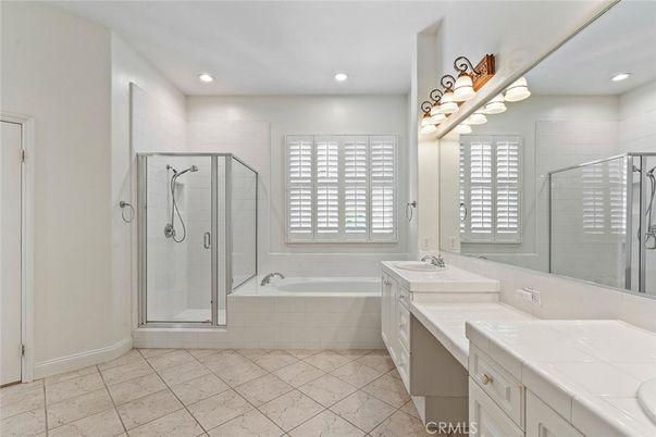 Bathroom, Dual Sink Vanities, Glass Shower, Interior, Recessed Lighting, Tile Countertops